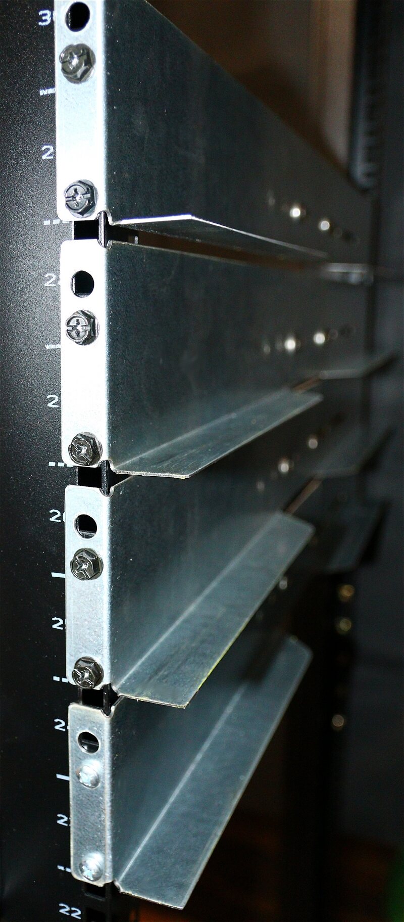 Close view of installed galvanized universal rails and mounting faces